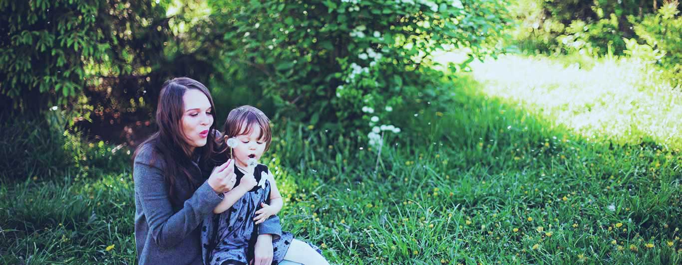 A mother and child in the garden waiting for a nurse practitioner to do a Life Insurance medical exam.